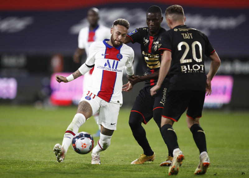 Paris St Germain's Neymar in action with Stade Rennes' Flavien Tait during the Ligue 1 match between Stade Rennes and Paris St Germain at Roazhon Park in Rennes, France on May 9, 2021. \[REUTERS/Stephane Mahe\]