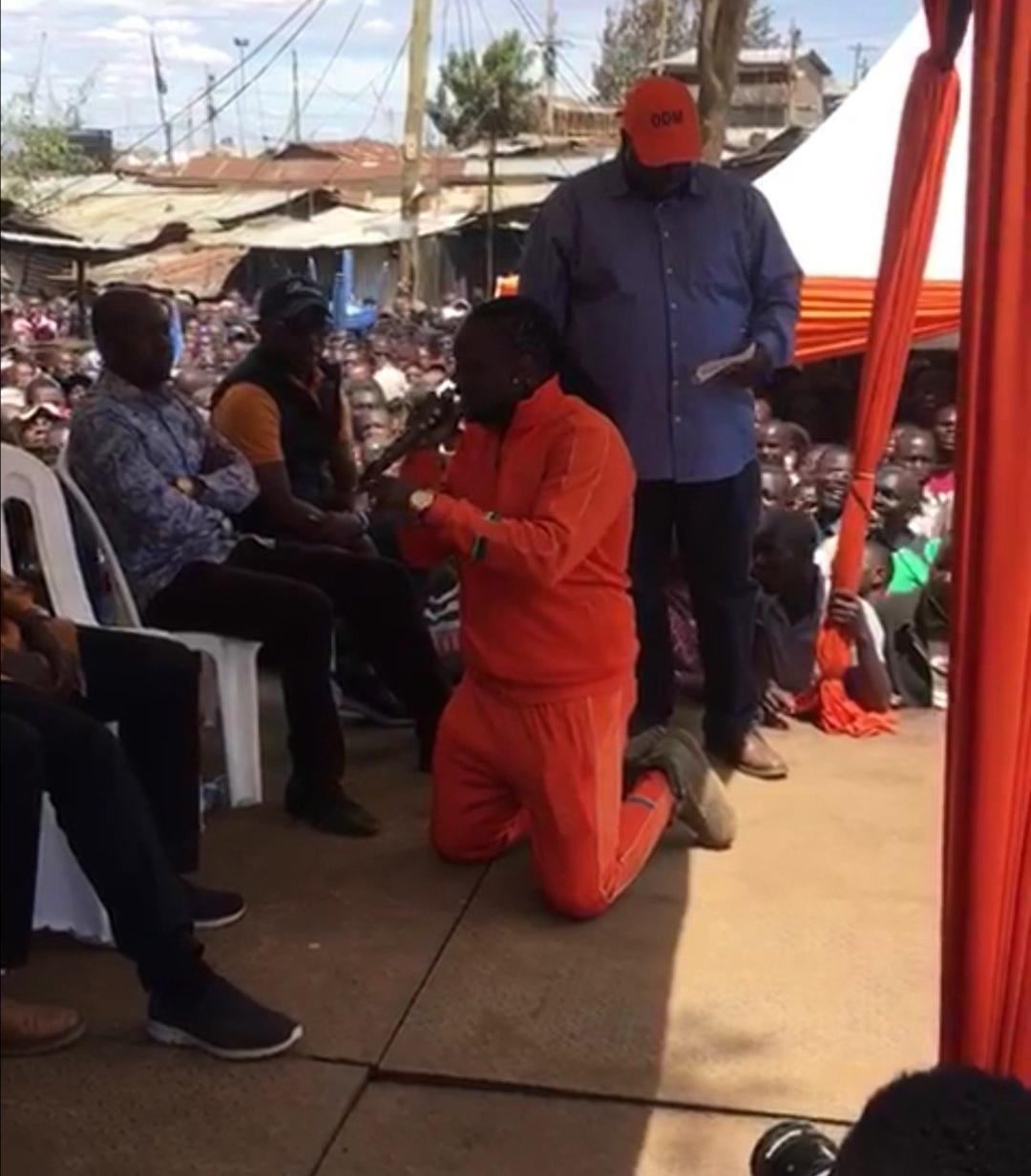 NTV Presenter Kneels Before Raila, Begs for ODM Ticket