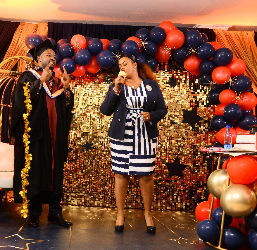 CAPTION: Married Kirinyaga County Chamber of Commerce Chairman Peter Waweru (L) during his post-graduation party hosted by Laikipia Women Rep Cate Waruguru