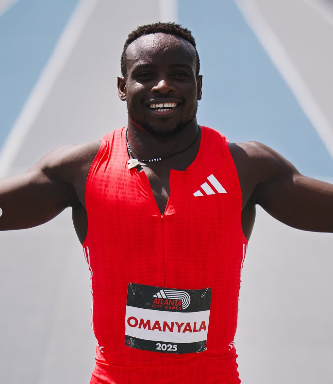 Ferdinand Omanyala celebrates after setting a new African record in the men's 150-meter race at the Atlanta City Games.