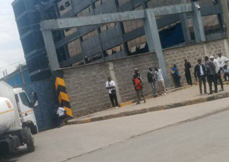 Scam recruiters allegedly operating outside DPL Festive Bread, luring desperate jobseekers with false promises and cash demands.